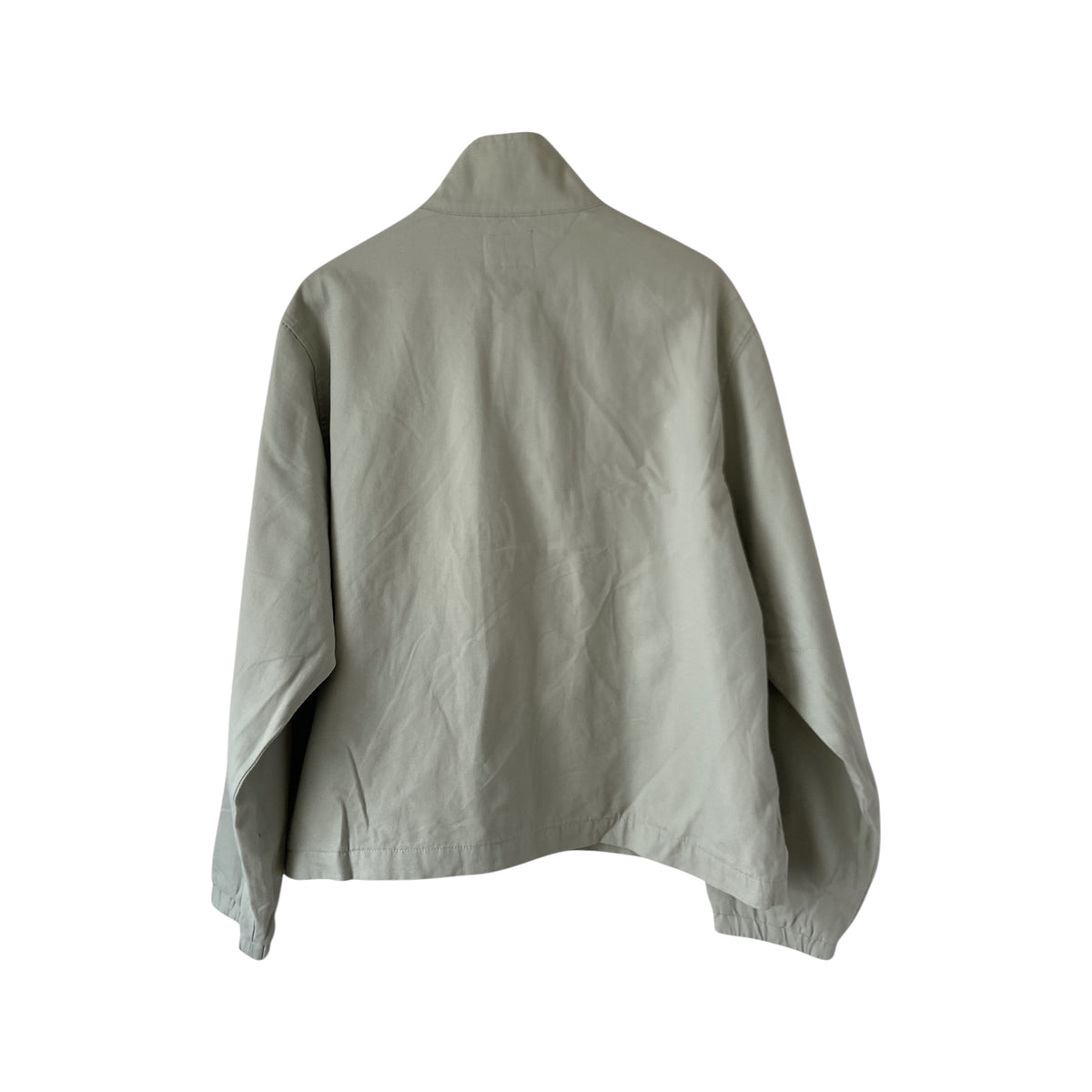 Tommy Hilfiger women's denim jacket with classic design, visible stitching, and branded logo on chest in a casual outdoor setting.