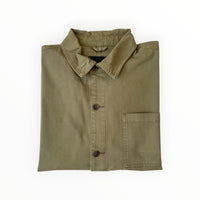 Tommy Hilfiger Chore Jacket Workwear in navy with front pockets and button closure, displayed on a hanger.