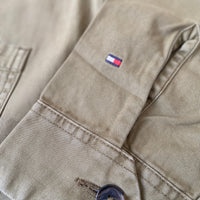 Tommy Hilfiger workwear chore jacket by BITAMBS, featuring durable fabric, classic design, and multiple front pockets.