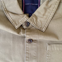 Tommy Hilfiger chore workwear jacket in dark fabric with front pockets and button closure, styled by BITAMBS.